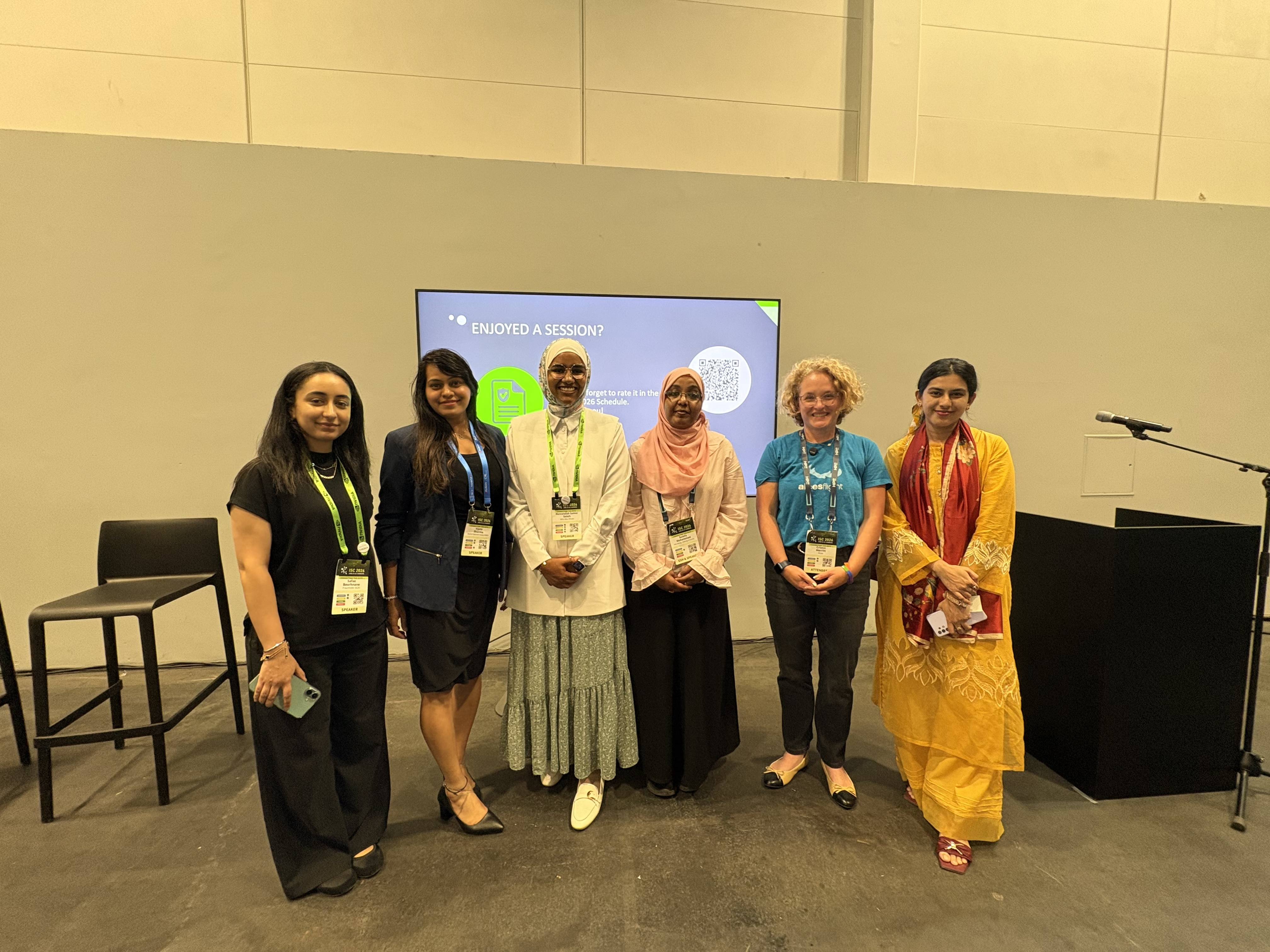 Mennatallah Samier Saleh and Safae Bourhnane with other attendees at the WHPC community meet-up at ISC 2026